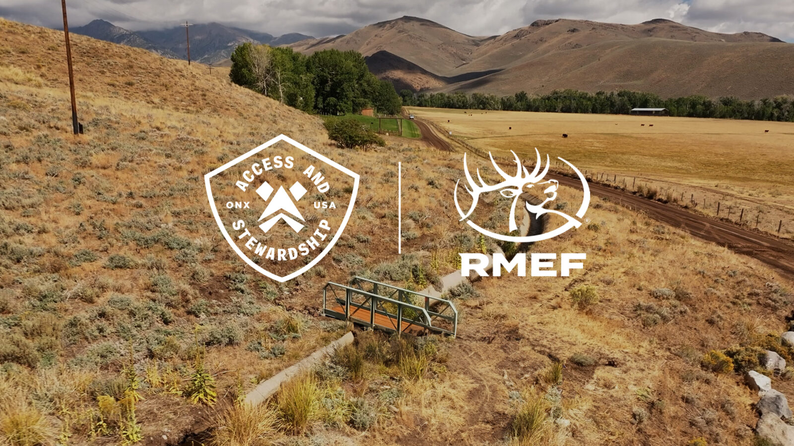 Public land with foothills with the onX access and stewardship logo and the RMEF logo